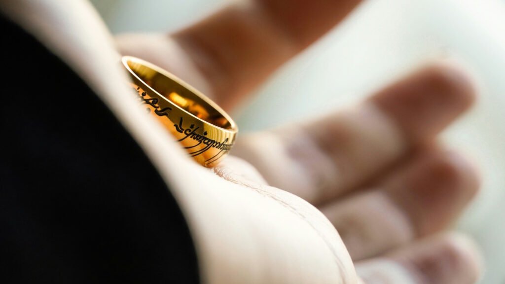 A person holding the one ring in her hand.
