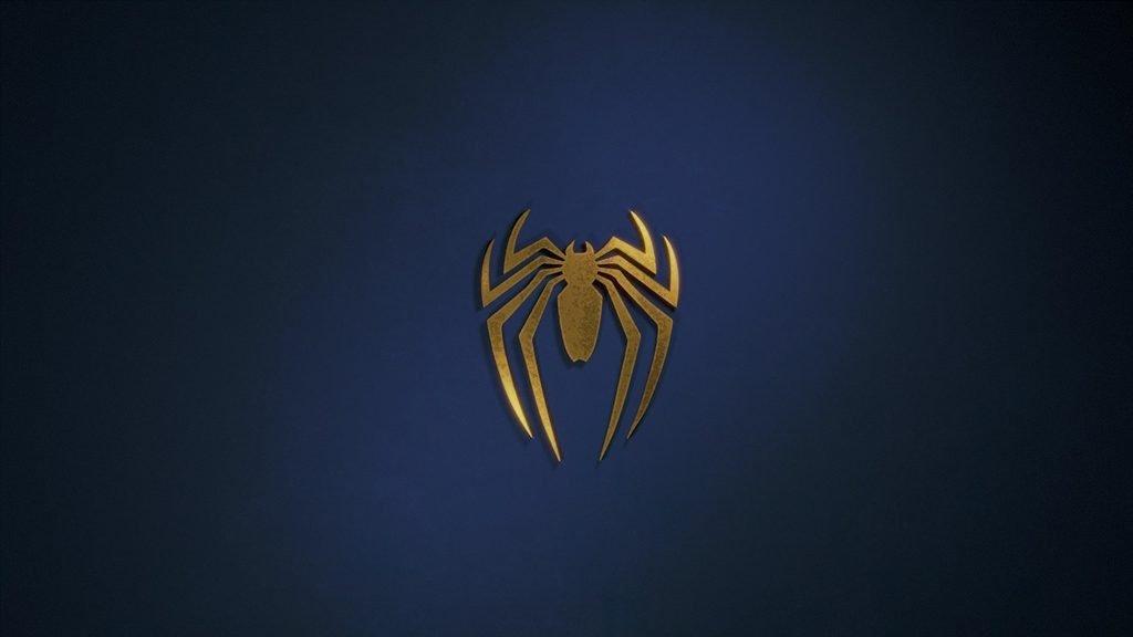 A photo of spiderman’s emblem against a dark blue background.