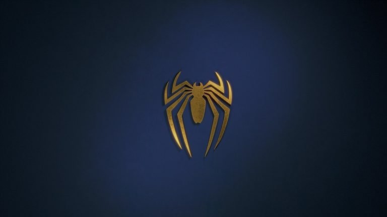 A photo of spiderman’s emblem against a dark blue background.